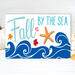 This whimsical autumn-themed coastal sign with bright blue waves, fall leaves, and an orange resin starfish for your coastal fall decor.